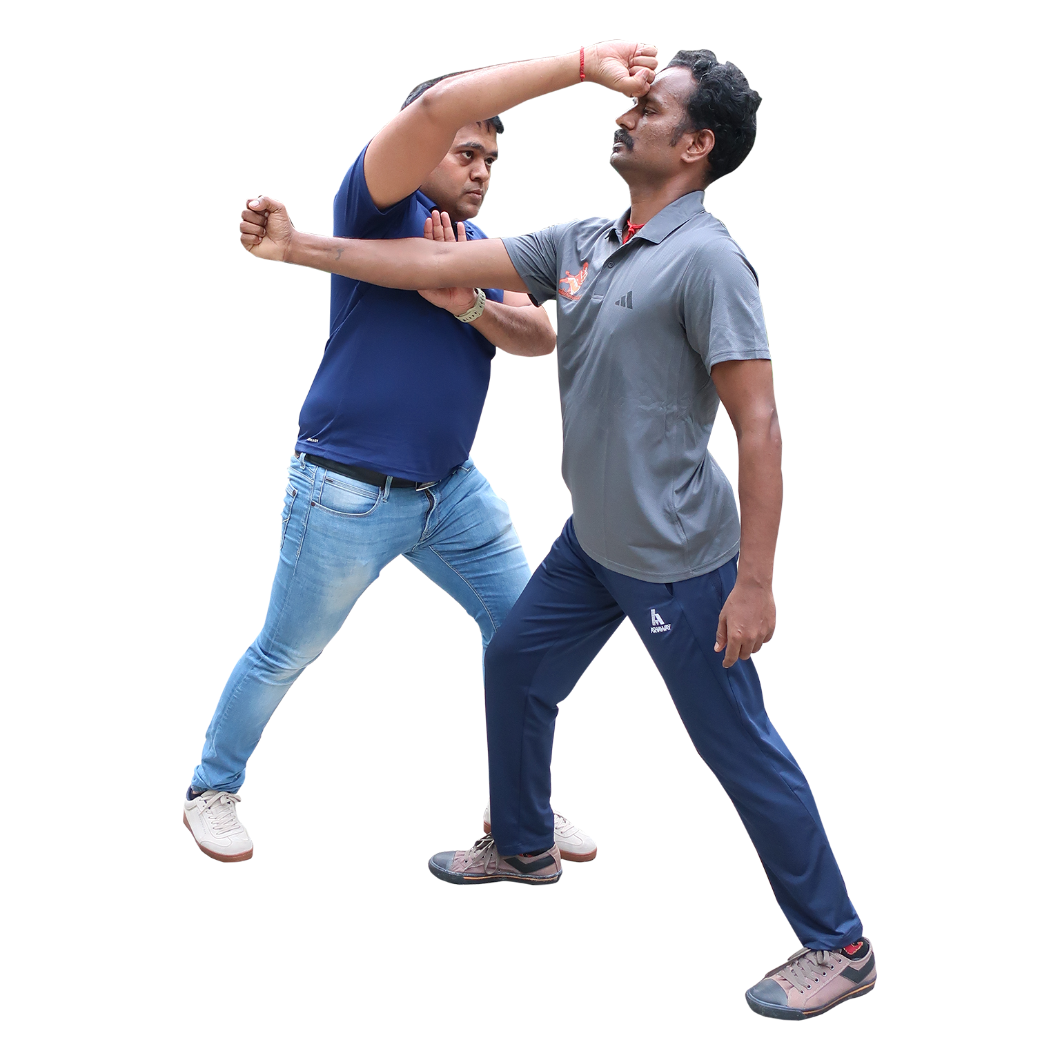 Martial artist practicing Varma Kuthu Varisai in traditional attire, showing precise and fluid movements.